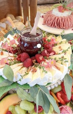 fruit and cheese platter with jam on top