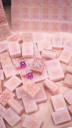 some pink dices are laying on a table