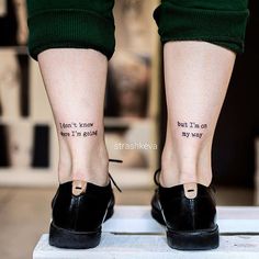 the legs and ankles of a woman with tattoos on them