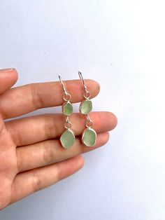 Handmade Seaglass Earrings, each sea glass is handpicked from the southwest coastline. The length of the earrings is 4cm. each seaglass is roughly 0.8-1cm wide. making them a statement piece and perfect for everyday wear. All products are made to order, which makes them unique. I handcraft all my earrings, from sawing, soldering, assembling, polishing and packaging!  Images on this listing are just for reference, all the seaglass are slightly different in size and colour, but the design of your earrings will remain unchanged :) The earrings are all made from 100% recycled sterling silver. All earrings come in a Kraft gift box, making them the perfect gift! 🤍 Aftercare: The earrings are made from sterling silver so they won't irritate the skin or change colour. But I do recommend taking of Nickel-free Recycled Glass Drop Earrings, Beach Earrings With Recycled Glass And Ear Wire, Nickel-free Teardrop Earrings In Recycled Glass, Handmade Dangle Sea Glass Jewelry, Nickel-free Teardrop Earrings Made Of Recycled Glass, Silver Hypoallergenic Earrings With Sea Glass, Silver Hypoallergenic Sea Glass Earrings, Handmade Sea Glass Dangle Jewelry, Nickel-free Teardrop Recycled Glass Jewelry