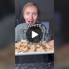 a woman making a funny face while looking at a plate of fudge cubes