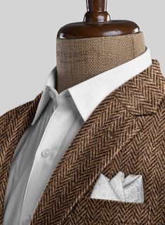 Unveil a legacy of style with our Harris Tweed Irish Brown Herringbone Suit, blending rugged charm with refined tailoring. Fashioned from pure wool, this suit features a herringbone weave that showcases a rich blend of earthy brown tones with intricate texture. The subtle pattern exudes timeless elegance, making it the perfect choice for any occasion. Whether you're attending a countryside wedding or stepping into a high-powered meeting, this suit ensures you stand out with confidence and class.  Look Includes    Harris Tweed Irish Brown Herringbone Fabric  Two Button Jacket Style  Notch Lapel   Horn   Brown  Buttons  Single Vent  Three Cuff Buttons  Two Welted Back Pockets on Trousers    Click 'Customize Now' to modify the look if needed.   Lining: Viscose, Dry Clean. Business Tweed Jacket With Herringbone Pattern, Formal Tweed Jacket With Herringbone Pattern, Semi-formal Herringbone Tweed Jacket, Timeless Tweed Jacket With Herringbone Pattern For Business, Timeless Business Tweed Jacket With Herringbone Pattern, Classic Wool Suits With Herringbone Pattern, Tweed Blazer With Herringbone Pattern And Suit Collar, Tailored Herringbone Pattern Suits, Tailored Tweed Jacket With Herringbone Pattern For Semi-formal