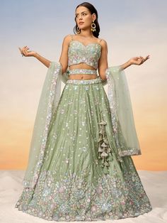 This stunning outfit features a pista green color chiffon lehenga with sequin and coding thread embroidered work, a chiffon choli with similar embroidery, and a net dupatta adorned with sequin work and ethnic motifs. The lehenga is semi-stitched up to 42 inches, with a 3.0-meter flair, and comes with unstitched choli material, making it customizable to your size.
This outfit includes intricate sequin and thread embroidered work, giving it a contemporary and elegant look. Perfect for weddings, pa Chiffon Lehenga, Green Lehenga Choli, Three Quarter Sleeve Blouses, Party Wear Gown, Green Lehenga, Lehenga Style, Patiala Salwar, Embroidered Chiffon, Pure Chiffon