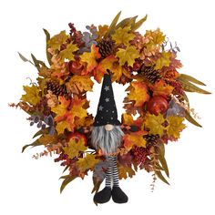 a wreath with an image of a gnome and autumn leaves on it, as well as a height chart