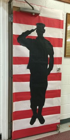 a door decorated with an image of a man saluting in front of the american flag