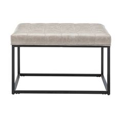 an upholstered bench with metal legs and a beige leather seat pad on top