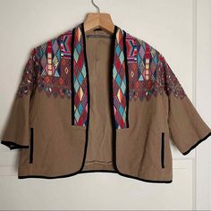 AnthropologieNEW Twelfth Street Cynthia Vincent Embroidered Crop Jacket Brown M 1222  NEW WITH TAGS!!!  Medium Open Front Short Sleeve Geometric Embroidery  Cropped  100% Cotton Cotton Long Sleeve Cropped Jacket For Streetwear, Folk Style Cotton Outerwear With Geometric Embroidery, Button-up Cropped Jacket With Pockets For Streetwear, Cotton Long-sleeve Cropped Jacket For Streetwear, Folk Style Outerwear With Geometric Embroidery, Hmong Fashion, Half Jacket, Embroidered Coat, Geometric Embroidery