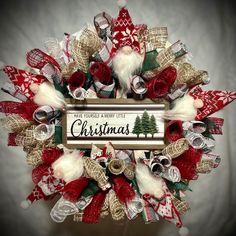 a christmas wreath with santa claus and other holiday decorations