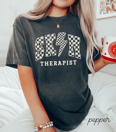 This retro checkered "skin therapist" tee would make the perfect work shirt for estheticians! Want this in a sweatshirt instead? You can find it here: https://www.etsy.com/listing/1744299173 * HOW TO ORDER * 1. Look through the photos at the different colors and the sizing chart (all shirts & sweatshirts are unisex sizing) 2. Select the size and color you want from the drop down menus. 3. Choose the quantity you want in that size and color. 4. If applicable, add your custom wording under the "personalization" tab. 5. Click "add to cart" then you can go back and add different colors and sizes the same way if wanted. 6. Click "proceed to check out" 7. Wait for your new favorite shirt or sweatshirt to come in and enjoy! * BELLA CANVAS 3001 SHIRT MATERIALS & WASHING INSTRUCTIONS * - 100% combe Esthetician Attire, Graduating Esthetician School, Esthetician Outfit Ideas, Esthetician Shirts Ideas, Esthetician Outfit, Esthetician Shirts, Esthetician Tee Shirts, Esthetician Crewneck, Esthetician Apparel