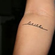 a woman's arm with the word little on it