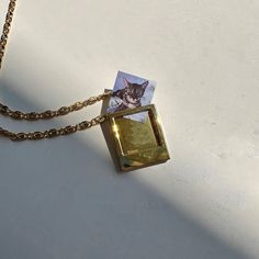 Our perfectly petite Polaroid Charm fits a tiny photo of anything you want to keep close to your heart. Slide this onto an existing necklace or browse our selection of strands & chains for the perfect pairing. Chain NOT included. Need help getting the perfect sized photo? Print out our handy locket template: https://honeycat-jewelry.com/pages/locket-photo-template-guide Charm measures 15.5mm x 18.5mm and fits a 13mm x 13mm photo (which is about 1/2 inch x 1/2 inch). Our materials make for an ama Memory Necklace, Photo Polaroid, Polaroid Photo, Picture Pendant, Memory Locket, Mood Ring, Polaroid Photos, Photo Charms, Memorial Necklace