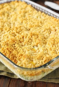 a casserole dish with crumbs in it sitting on a wooden table