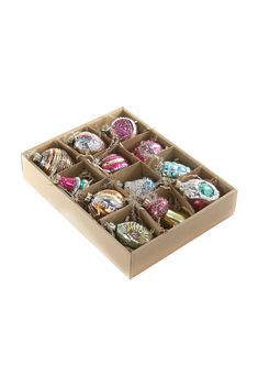 a box filled with lots of different types of candies on top of each other