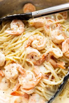 pasta with shrimp and parmesan cheese in a skillet, ready to be eaten