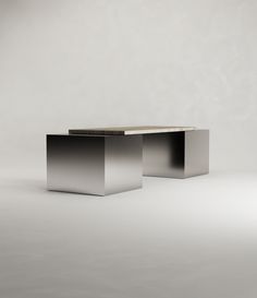 two square tables sitting side by side on a plain surface with no one around them