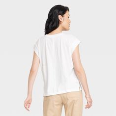 This Short-Sleeve Extended Shoulder T-Shirt from A New Day™ offers the perfect way to add a chic new option to your wardrobe. The solid-color T-shirt is made from a breathable fabric blend for all-day comfort, and it can be dressed up or down to fit any occasion. It's tailored in a casual fit that hits at the hip and features side vents and short sleeves with extended shoulders for an extra-stylish touch. A New Day™: Style that goes wherever you do. Neutral Shirt, Ribbed Tank Tops, Hem Style, Supima Cotton, Casual Fit, Workout Tank Tops, Womens Clothing Sizes, Casual Fits, A New Day