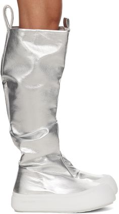 Knee-high laminated grained faux-leather boots in metallic silver tone. · Gathering throughout · Rubber cap toe · Pull-loops at heel collar · Logo embossed at heel tab · Padded footbed · Jersey lining · Logo embossed at rubber midsole · Treaded rubber sole · Platform: H1.75 Supplier color: Metallic Knee High Platform Boots, Metallic Boots, Silver Boots, Faux Leather Boots, Boots Knee, Platform Boots, Boot Shoes Women, Leather Fashion, Knee High Boots