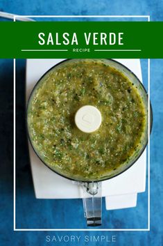 salsa verde recipe in a food processor on a blue background with text overlay that reads salsa verde recipe savory simple