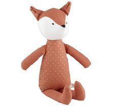 a small stuffed fox with polka dots on it's face and tail, sitting in front of a white background