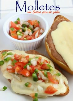 an open faced sandwich with cheese and vegetables on it next to a bowl of salsa