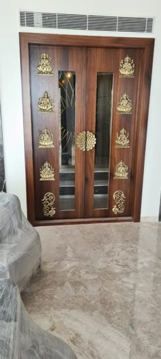 a large wooden door with ornate carvings on it's sides and glass panels above the doors