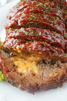 the meatloaf is stuffed with cheese and sauce