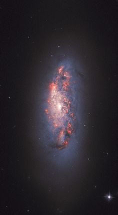 an image of a spiral galaxy in the sky