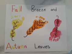 a sign that says fall, breeze and autumn leaves with handprints on it