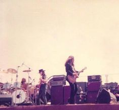 a group of people on stage playing instruments