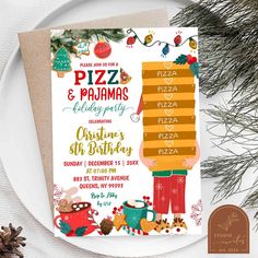 a pizza and pajamas birthday party is set on a plate with pine cones, evergreens and other holiday decorations