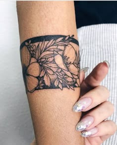 a woman's arm with flowers on it and the words instagram written in black ink