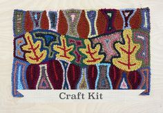 the craft kit is designed to look like an art work with colorful leaves on it