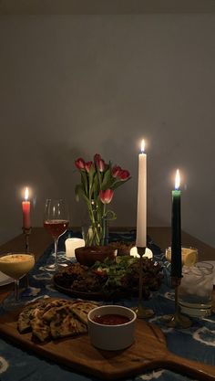 a table with candles and food on it