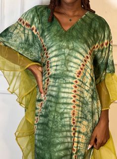 Bask in the sun's kiss with this exquisite Tie Dye Dress, proudly crafted by artisans in Nigeria. This blend of casual and classy is a limited edition - perfect for those who value unique style. Embrace this special look and let your radiance shine! Elegant Green Maxi Dress For Festival, Elegant Green Beach Cover-up Dress, Elegant Green Dress For Festival, Summer Tunic Style Kaftan Dress, Summer Tunic Kaftan Dress, Silk Tunic For Spring Vacation, Bohemian Silk Dress For Spring Vacation, Spring Vacation Silk Tunic, Bohemian V-neck Silk Dress For Summer