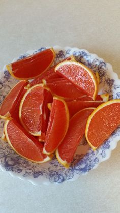 slices of grapefruit on a blue and white plate