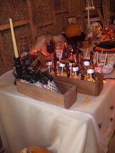 a table topped with lots of candy and candles