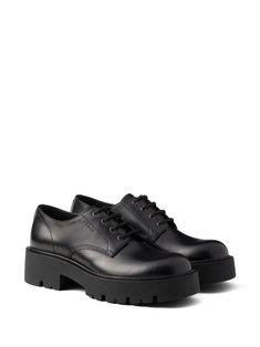 Find PRADA Chunky Sole Leather Derby Shoes on Editorialist. black calf leather smooth grain matte finish debossed logo to the side front lace-up fastening chunky rubber lug sole leather insole Debossed Logo, Derby Shoes, Lug Sole, Calf Leather, Black Shoes, Derby, Prada, Grain, Lace Up