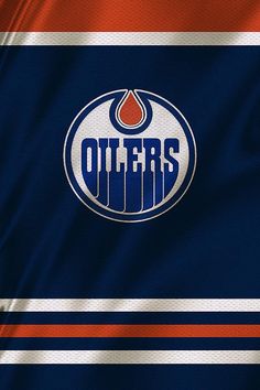 the edmonton oilers logo on an orange, blue and white striped jersey with red stripes