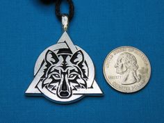 Welcome! We are happy to present another of our Therian creations, a Tribal Wolf set inside a Theta-Delta symbol. This listing is for one hand-cast lead-free silver pewter pendant that was designed and handmade by my husband and I. It measures: 1 1/2" wide x 1 3/4" tall including the necklace hanger, or 4.0 cm at the base by 4.5 cm tall including the necklace hanger. It is available in small, medium and large sizes:  Small:  https://www.etsy.com/listing/218697944/tribal-wolf-therian-symbol-other Therian Wolf, Delta Symbol, Wolf Therian, Pride Necklace, Necklace Hanger, Pewter Jewelry, Wolf Necklace, Pewter Pendant, Pewter Metal