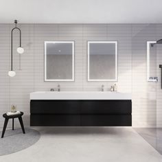 a bathroom with two sinks and mirrors on the wall