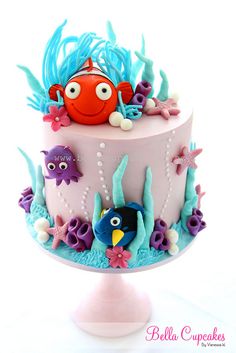 a colorful cake decorated with sea animals and fish