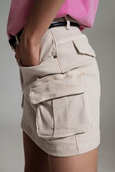 Cargo Mini Skirt in Beige - Szua Store Utility Style Cotton Mini Bottoms, Utility Mini-length Cotton Bottoms, Mini Length Utility Cotton Bottoms, Cotton Mini Bottoms With Side Pockets, Beige High Waist Mini Skirt With Pockets, Beige High-waist Mini Skirt With Pockets, Cotton Utility Mini Skirt, Utility Style Cotton Mini Skirt, High Waist Beige Cotton Cargo Skirt