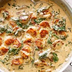 a pan filled with shrimp and cheese soup