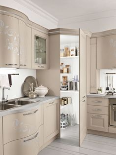 a kitchen with beige cabinets and white flooring is pictured in this image from the inside