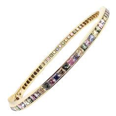 18k Yellow Gold Sapphire & Other Pastel Color Stone Bangle Bracelet by Julius Cohen. Stones Include: Spinels, Iolites, Sapphires, and More. Details: Size: 6.75" Weight: 22.3 grams Width: 4mm Stamped Hallmarks: Julius Cohen (18k Stamp Under The Saftey Clasp) *Free Shipping within the United States* Your Price: $12,350 2980oaxrd Geometric Bangle, Art Nouveau Ring, Metal Cuff Bracelet, Yellow Gold Bangle, Stone Bangle, Color Stones, Unisex Bracelets, Gold Bangle Bracelet, Color Stone