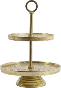 two tiered brass plate with an oval handle on each side and a circular ring at the top