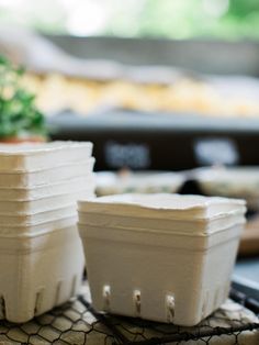 several plastic containers sitting on top of a table