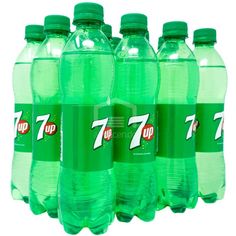 seven bottles of 7 up soda are lined up