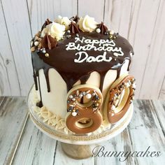 a birthday cake with chocolate frosting and decorations