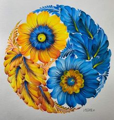 a painting of blue, yellow and orange flowers in a circular arrangement on white paper